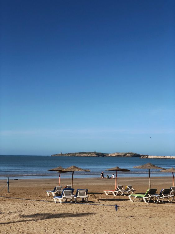 Serene beach scene with chairs and umbrellas in Morocco