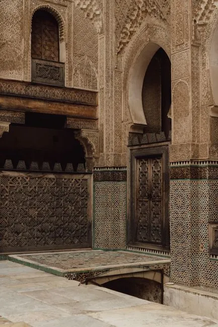 The ornate interior of the Bou Inania Madrasa in Fes, Morocco