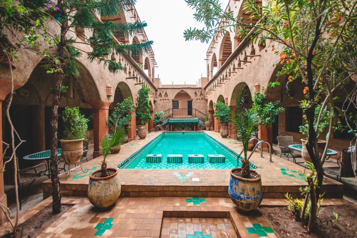 Lush greenery and fountains inside Le Jardin Secret