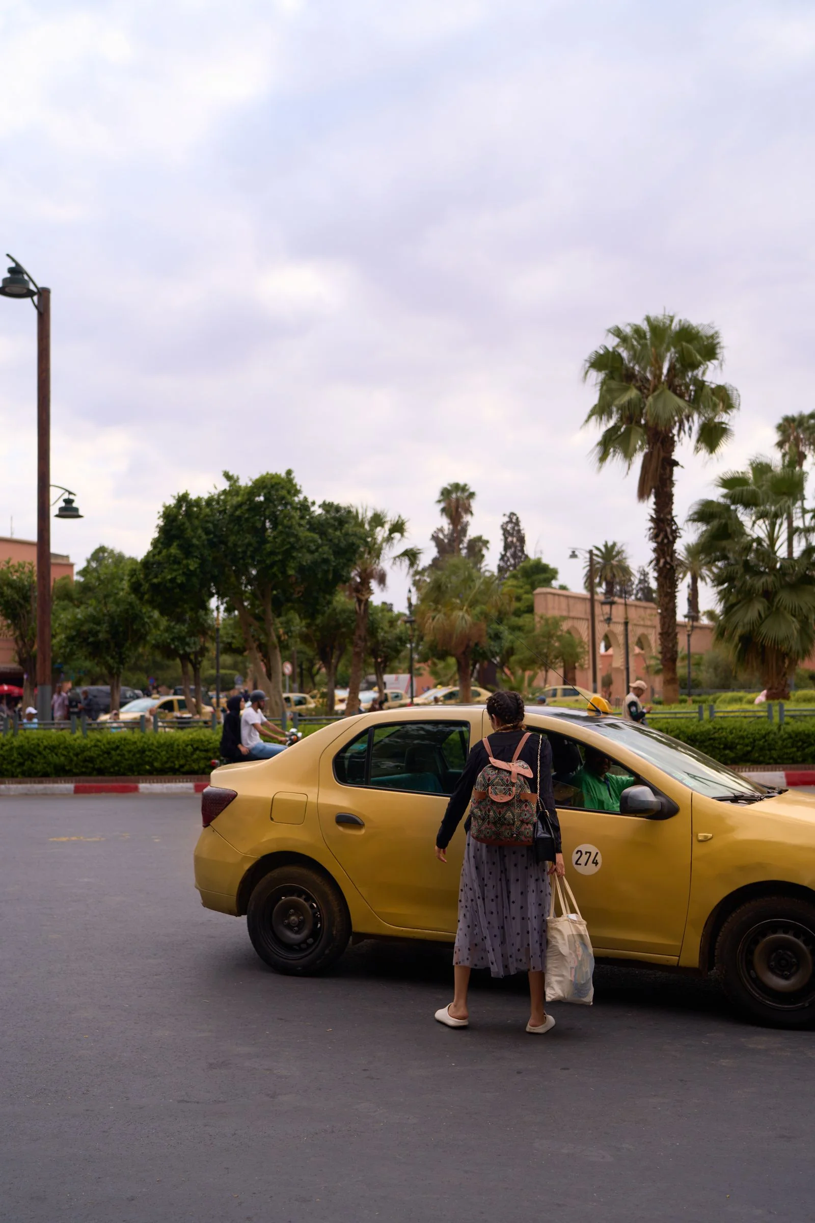 Female traveler seated in a taxi traveling through Morocco