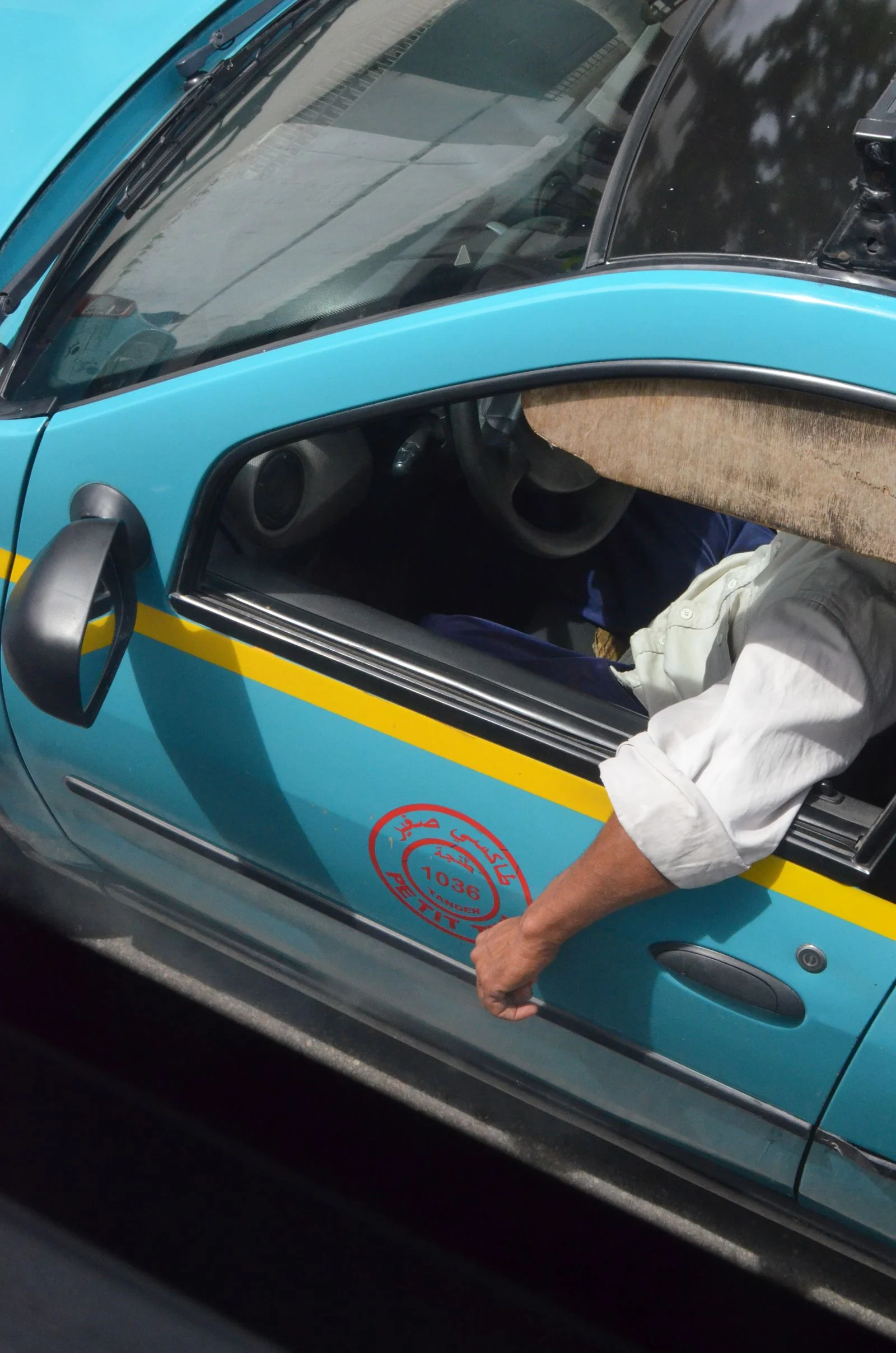A passenger riding in a taxi traveling through Morocco