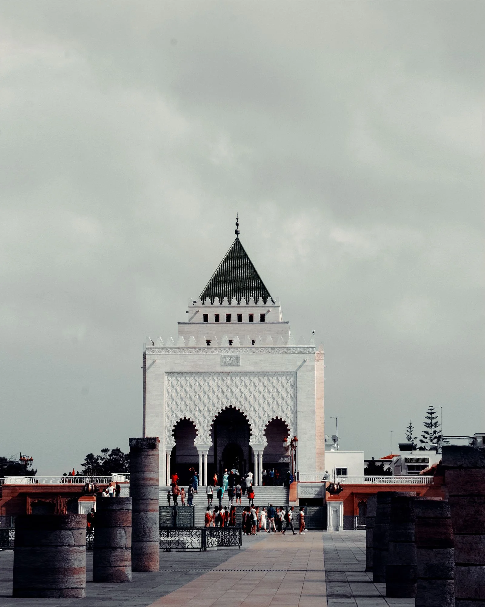 Tourists visiting the courtyard of the Mausoleum of Mohammed V in Rabat